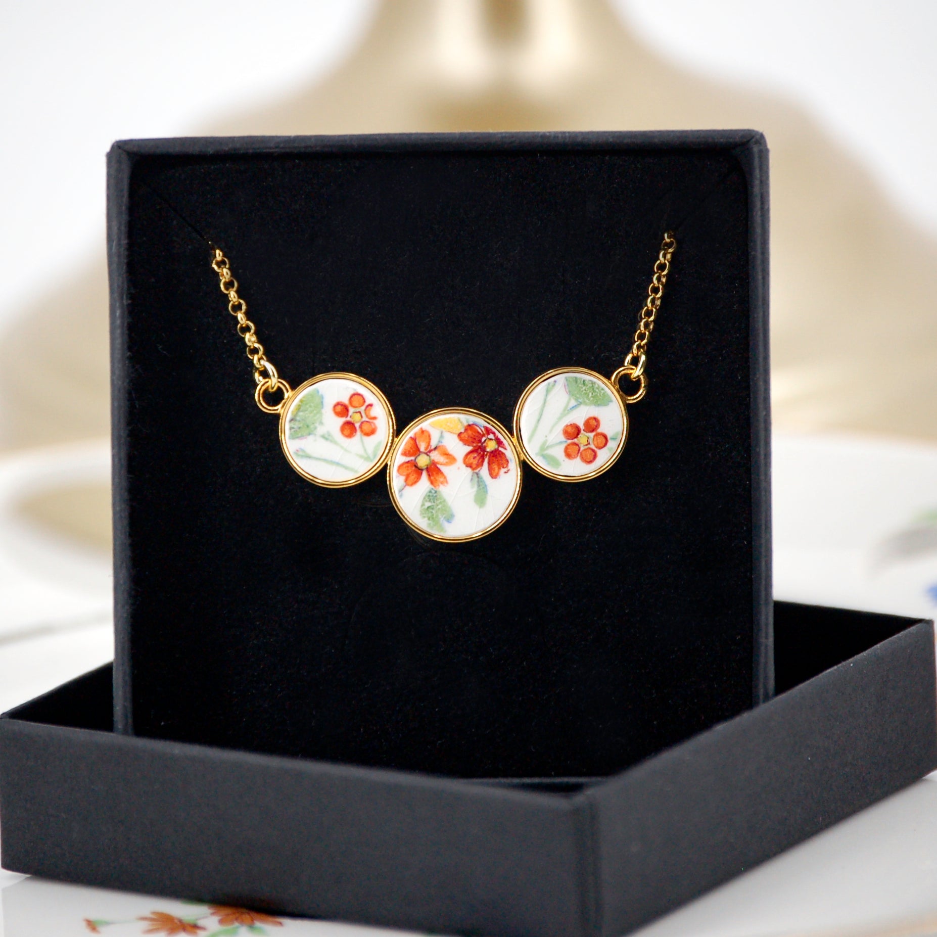 Pendentif "Petites fleurs oranges "
