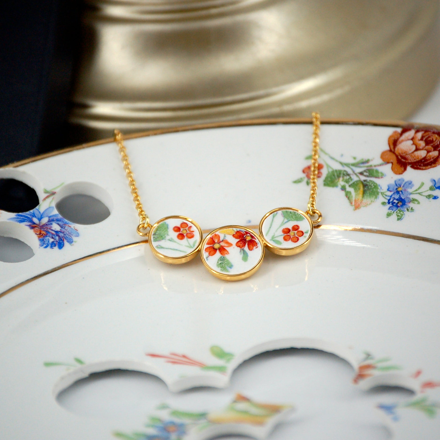 Pendentif "Petites fleurs oranges "